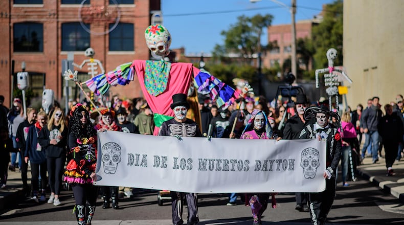 Dia De Muertos or Day of the Dead was celebrated in Dayton over the weekend on Sunday, Oct. 21 with a parade and celebration that included Day of the Dead alters, food, sugar skulls, music, traditional dance and more. TOM GILLIAM / CONTRIBUTING PHOTOGRAPHER