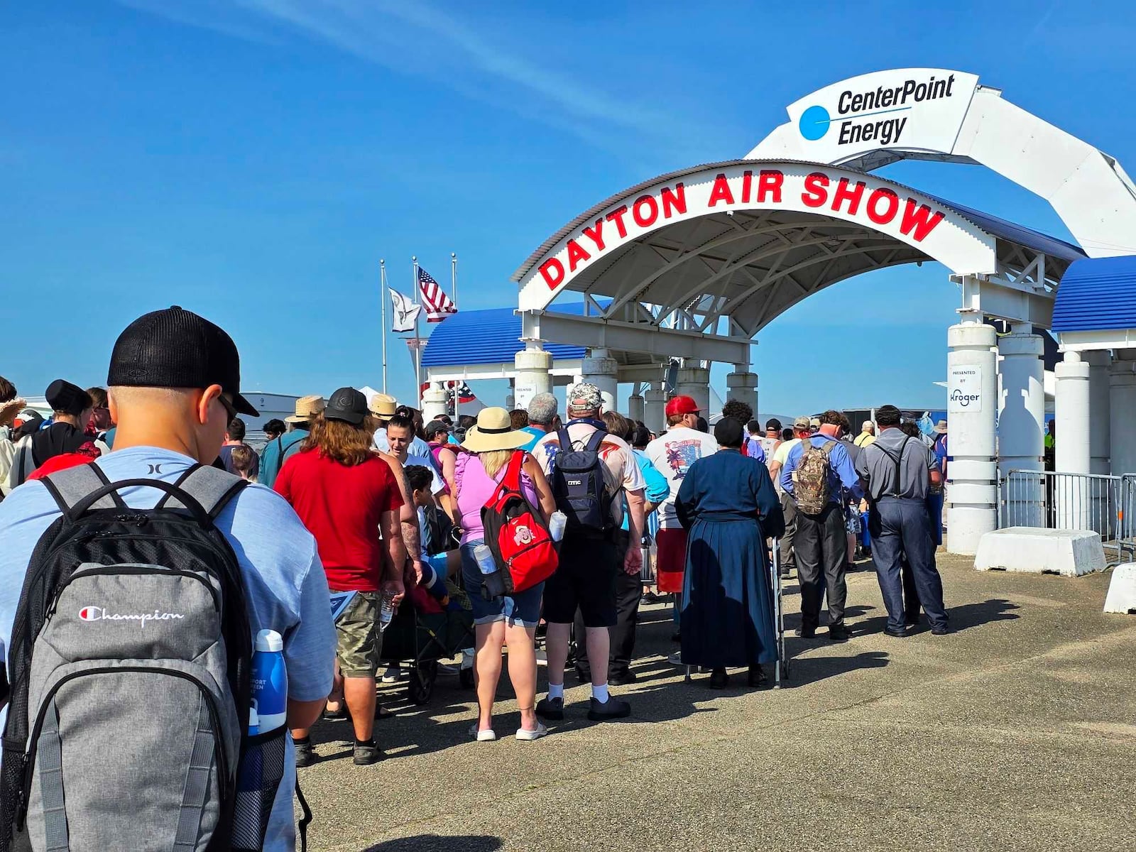 People line up to enter the CenterPoint Energy Dayton Air Show Saturday, June 21, 2025. NICK GRAHAM/STAFF
