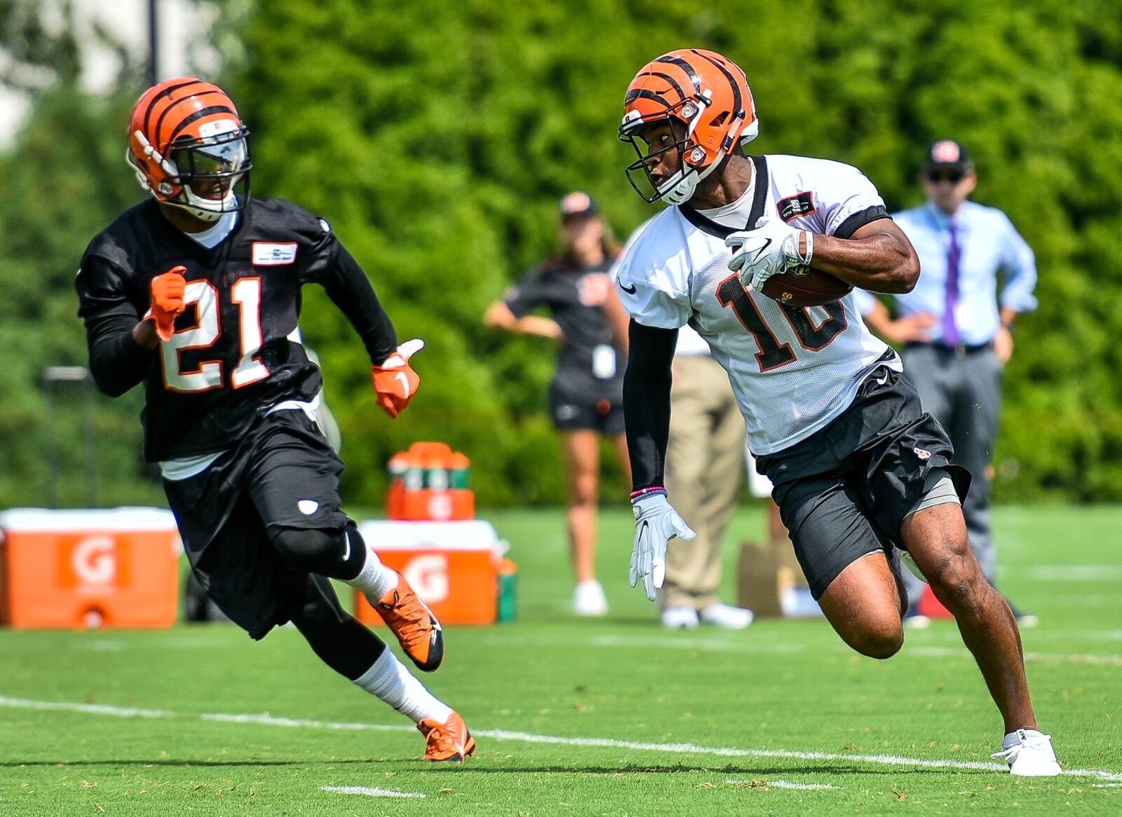 Wide receiver Cody Core (16) carries the ball defended by cornerback Darqueze Dennard during the first day of Cincinnati Bengals Training Camp Friday, July 28 at the practice fields beside Paul Brown Stadium in Cincinnati. NICK GRAHAM/STAFF