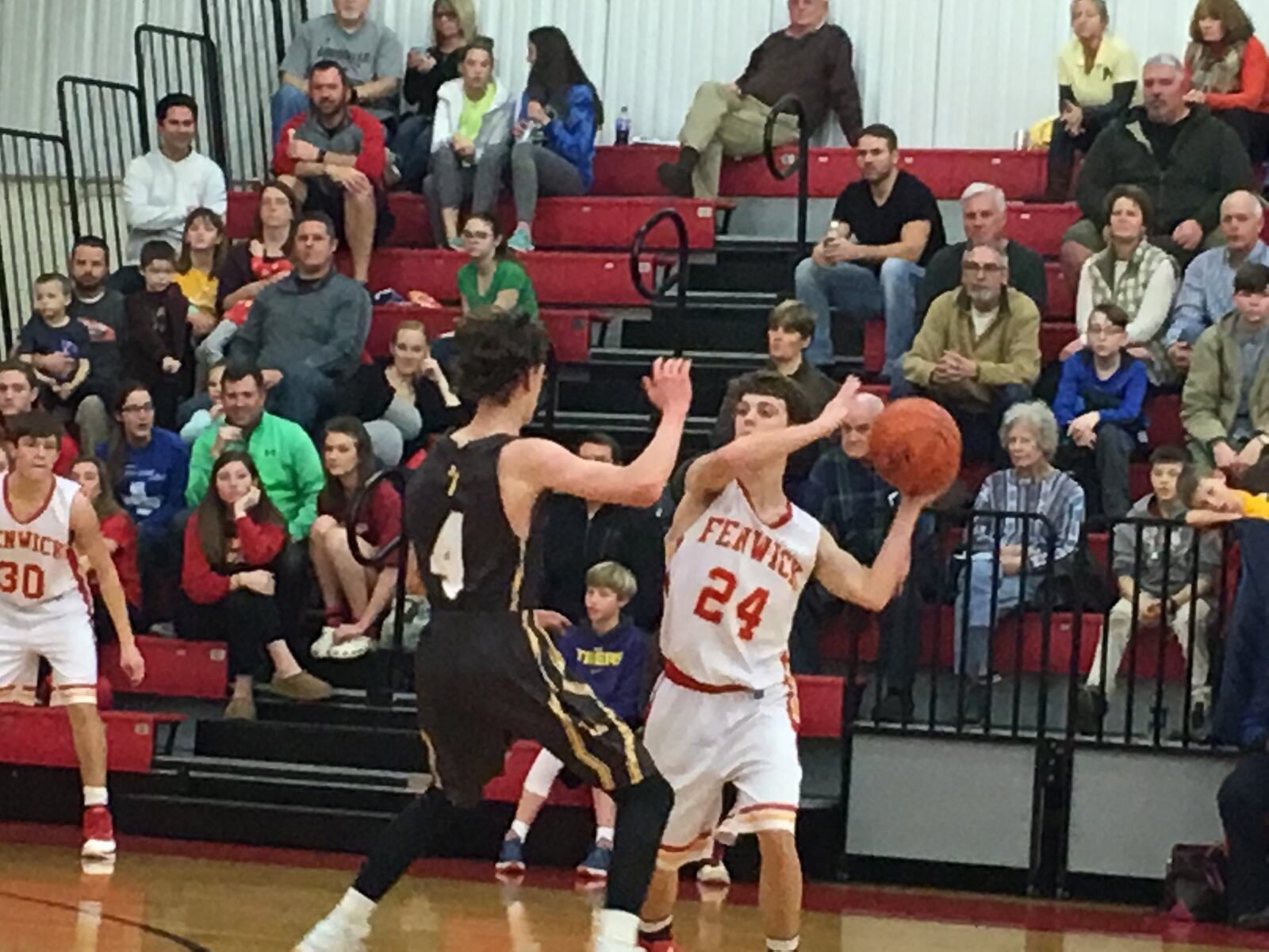 Fenwick’s David Luers (24) is guarded by Alter’s James Finke during Friday night’s game at Fenwick. RICK CASSANO/STAFF