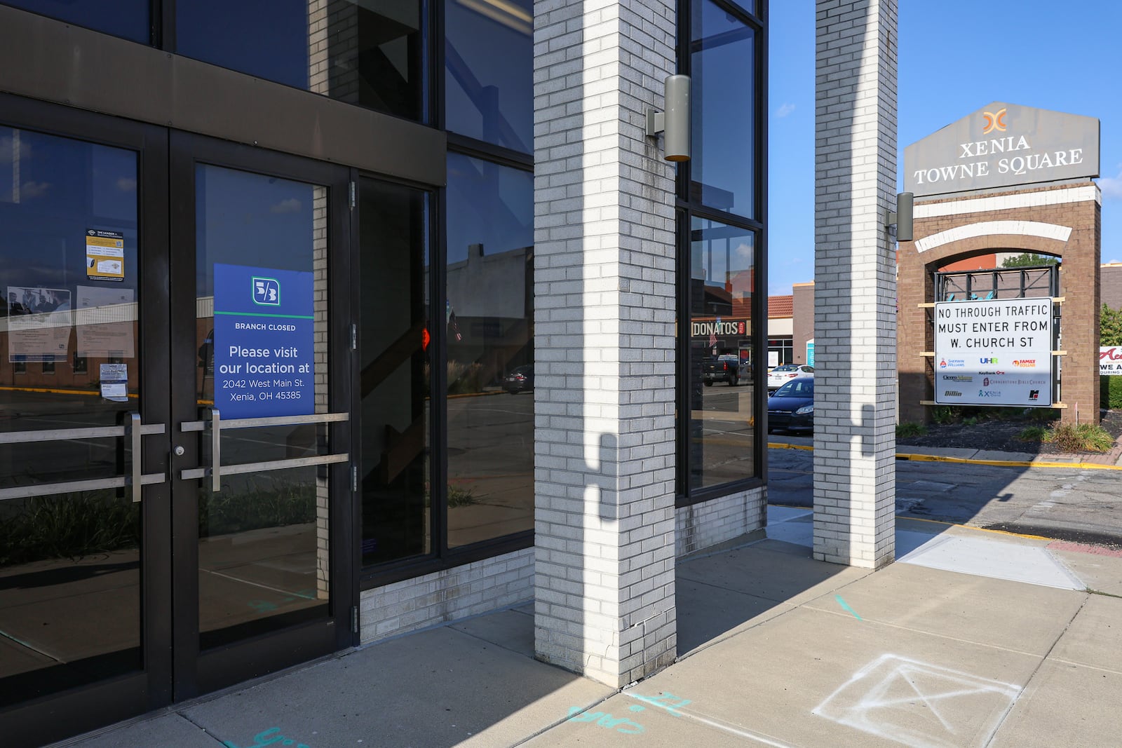 The site of the former Fifth Third Bank in Xenia Towne Square/Xenia Market District off West Main Street in downtown Xenia has been listed for sale. BRYANT BILLING / STAFF