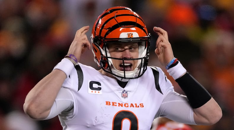 Cincinnati Bengals quarterback Joe Burrow calls an audible against the Kansas City Chiefs during the first half of the NFL AFC Championship playoff football game, Sunday, Jan. 29, 2023, in Kansas City, Mo. (AP Photo/Jeff Roberson)