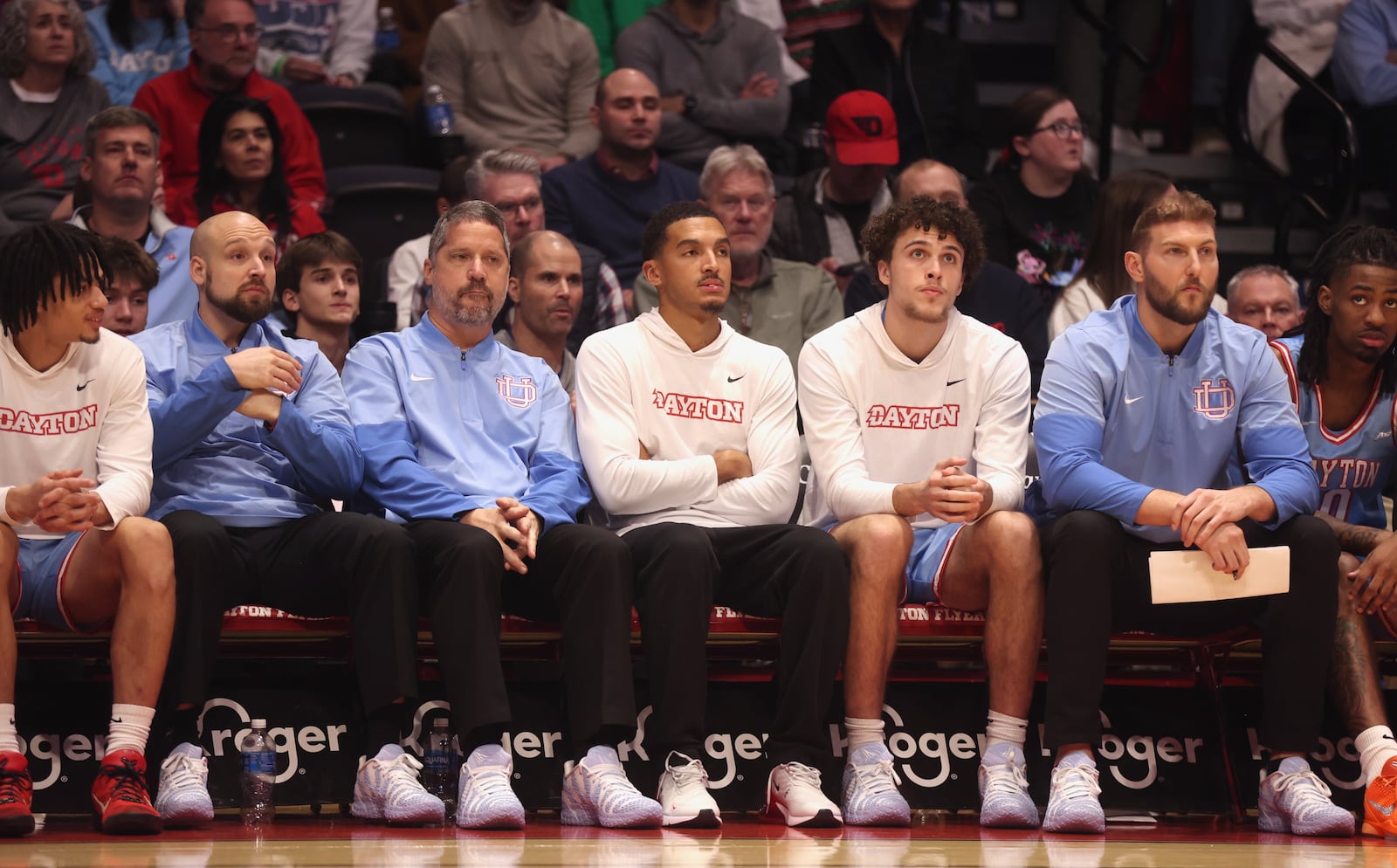 Dayton's Sean Pouedet, third from right, watches the action during a game against Florida State on Tuesday, Dec. 16, 2025, at UD Arena. David Jablonski/Staff