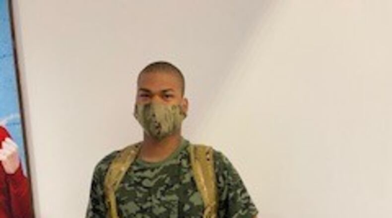 Camron Powell, a Wayne High School senior, poses in the Dayton International Airport after returning from basic training over the summer. Powell has enlisted in the Army National Guard. Contributed by Sherri Ladd.