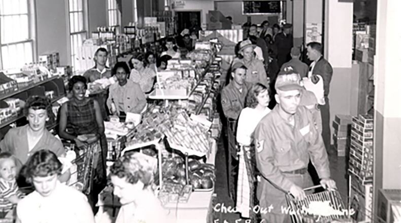 Air Force service members and families stand in line to check out their groceries at the Ellsworth Air Force Base Commissary, South Dakota, in May 1958. Courtesy photo/Defense Commissary Agency archives