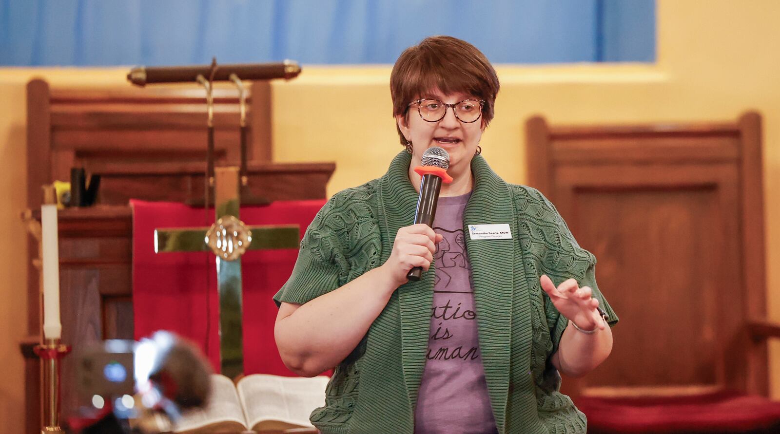 Ignite Peace program director Samantha Searls speaks during a community safety meeting "Be a Neighbor: Building a Better Springfield for All" hosted by the Amos Project on Thursday, Jan. 29, 2026, at Zion Hill Baptist Church. Organizers gathered to give tools and guidance with expected ICE activity after the Temporary Protected Status expires on Tuesday, Feb. 3, 2026. JOSEPH COOKE/STAFF