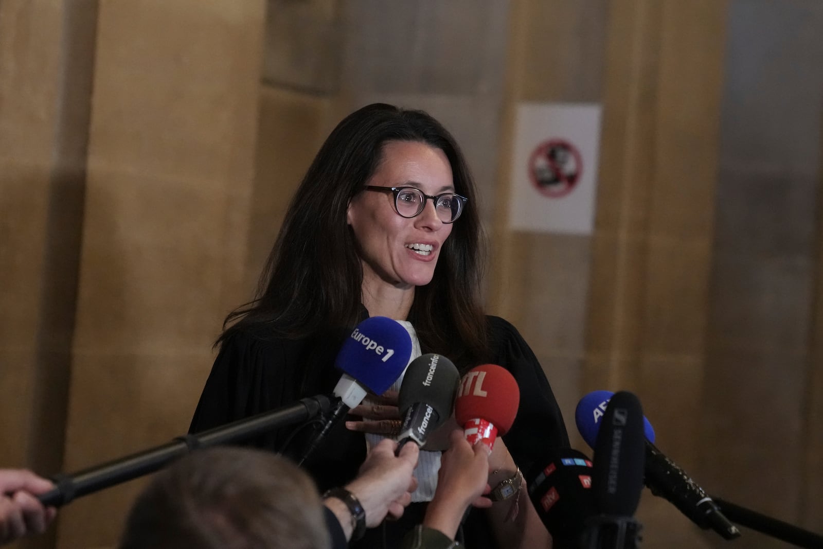 Kim Kardashian' s lawyer Leonor Hennerick answers reporter after the verdict in the 2016 armed robbery of Kim Kardashian Friday, May 23, 2025 in Paris. (AP Photo/Christophe Ena)
