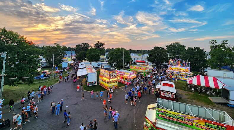 A large crowd gathered in the grandstand to watch the combine derby Saturday, July 27, 2024 at the Butler County Fair in Hamilton. The infield was busy in between rounds as contestants and crews worked to put the machines back together for the final round. NICK GRAHAM/STAFF