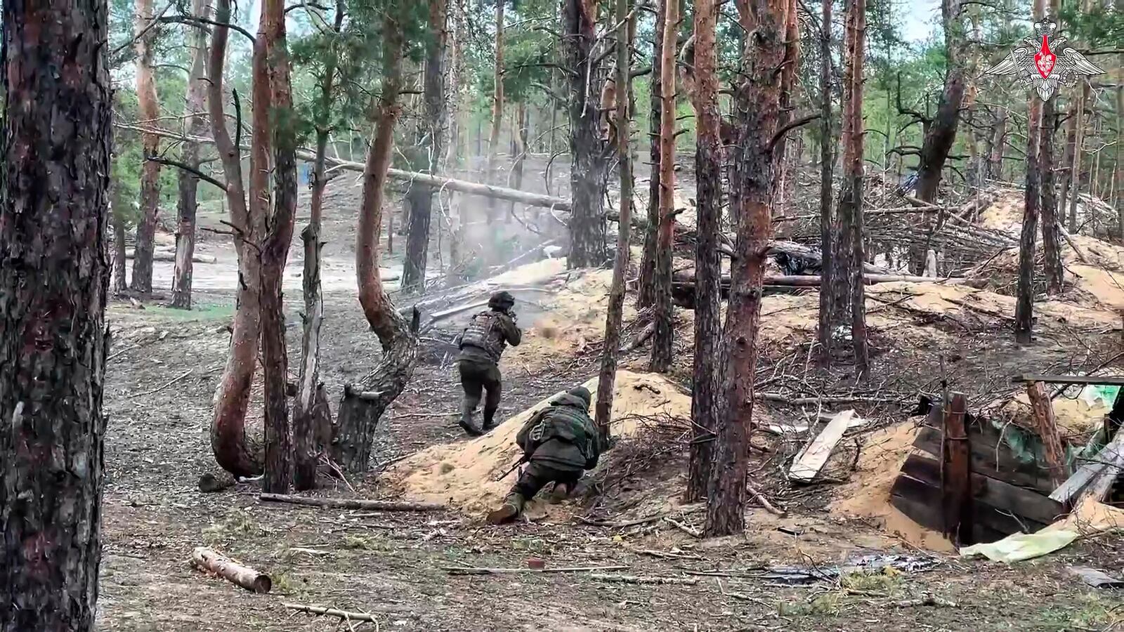 In this photo taken from video distributed by Russian Defense Ministry Press Service on Wednesday, May 21, 2025, Russian servicemen attend a combat training for assault units in an undisclosed location in Ukraine. (Russian Defense Ministry Press Service via AP)
