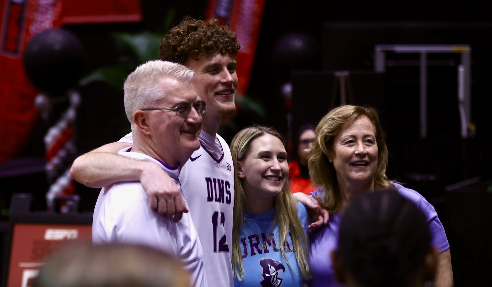 Centerville graduate Tom House, a senior at Furman, poses for a photo with his family after a victory against Richmond in the first round of the ESPN Events Invitational on Thursday, Nov. 27, 2025, at the State Farm Field House in Kissimmee, Fla. David Jablonski/Staff