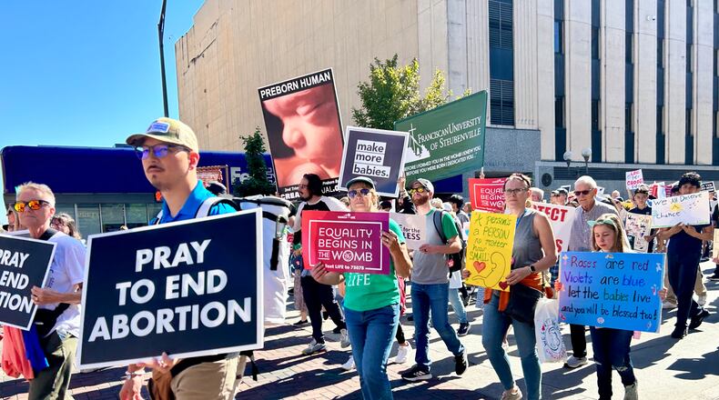 Anti-abortion advocates head south on High Street in Columbus during the 2024 Ohio March for Life. Oct. 4, 2024. AVERY KREEMER\STAFF