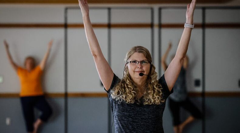 Wellness professional and community gem Kim Zehnder teaches yoga class at Charles Lathram Senior Center Thursday morning, Aug. 3, 2023. JIM NOELKER/STAFF