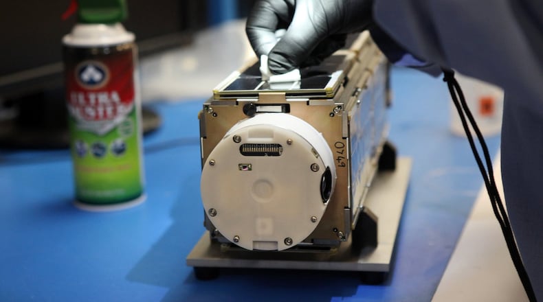 Mechanical engineer Alexander Wen works on Jan. 15, 2014, on a satellite camera at Planet Labs, a privately-funded company in San Francisco. (Karl Mondon/Bay Area News Group/TNS)
