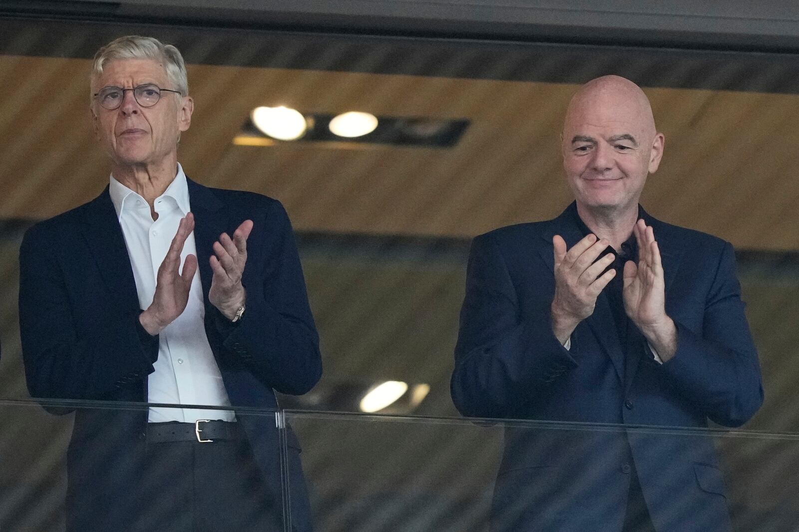 FIFA president Gianni Infantino, right, and Arsene Wenger, Chief Officer (FIFA) and former soccer coach arrive for the Women's Euro 2025 quarterfinals soccer match between Sweden and England at Stadion Letzigrund in Zurich, Switzerland, Thursday, July 17, 2025. (AP Photo/Martin Meissner)
