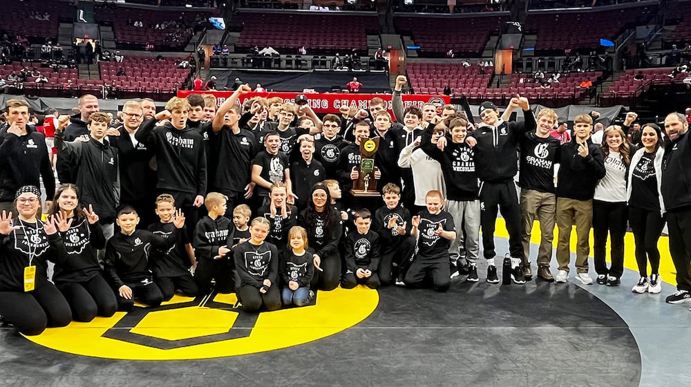 The Graham High School wrestling team celebrates their 25th consecutive team crown at the OHSAA State Wrestling Championships on Sunday, March 15, 2026 at Ohio State University's Schottenstein Center. GEOFF NEVILLE / CONTRIBUTING WRITER