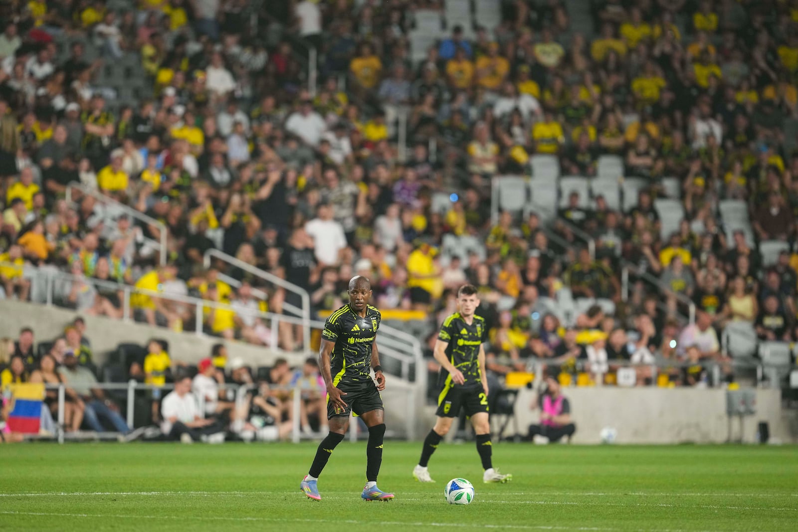 Columbus Crew midfielder Darlington Nagbe, left, controls the ball during the second half of an MLS soccer match against the Vancouver Whitecaps Saturday, June 14, 2025, in Columbus, Ohio. (AP Photo/Jeff Dean)