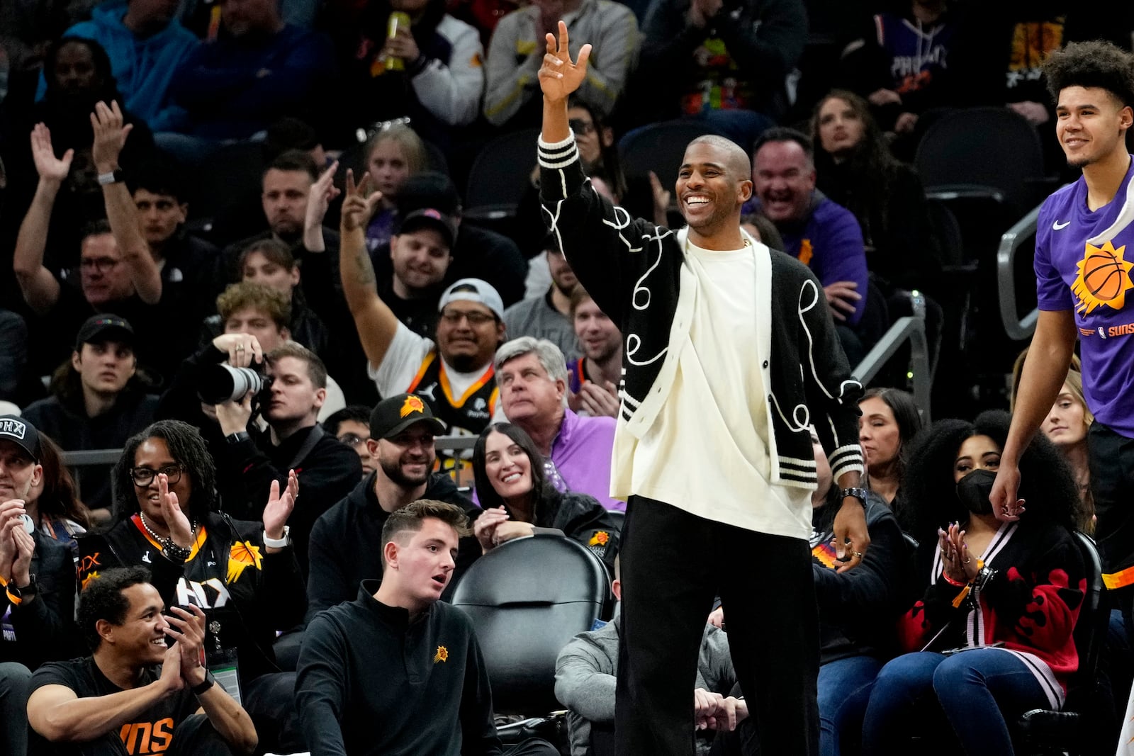 FILE - Phoenix Suns guard Chris Paul celebrates from the bench against the Brooklyn Nets during the first half of an NBA basketball game, Thursday, Jan. 19, 2023, in Phoenix. (AP Photo/Matt York, File)
