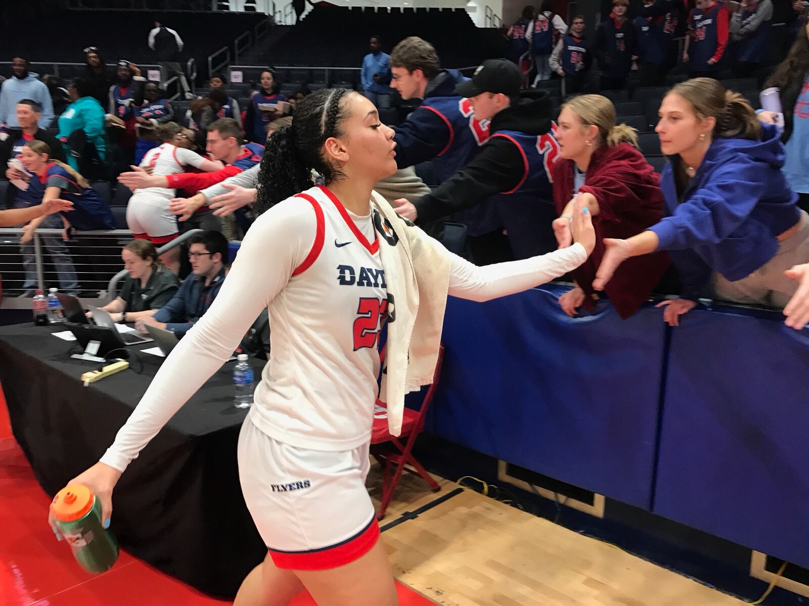 University of Dayton senior Mariah Perez greets fans after Saturday's game at UD Arena. Tom Archdeacon/CONTRIBUTED
