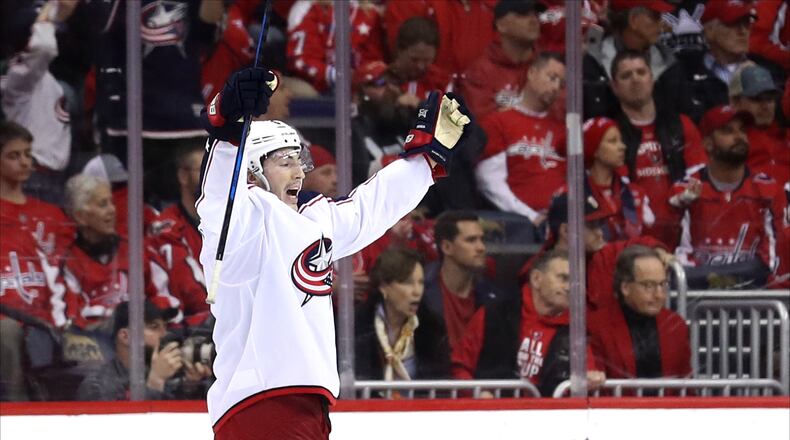 WASHINGTON, DC - APRIL 15: Zach Werenski #8 of the Columbus Blue Jackets celebrates after the Blue Jackets won 5-4 in overtime against the Washington Capitals during Game Two of the Eastern Conference First Round during the 2018 NHL Stanley Cup Playoffs at Capital One Arena on April 15, 2018 in Washington, DC. (Photo by Rob Carr/Getty Images)