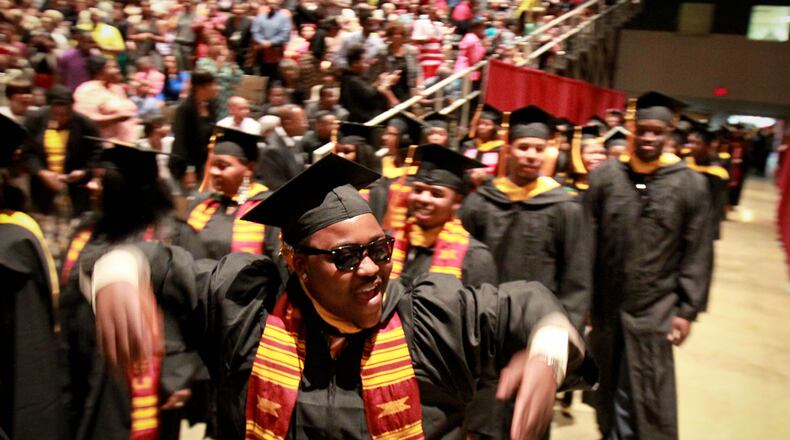 Central State graduates celebrate at a past commencement ceremony. STAFF FILE PHOTO