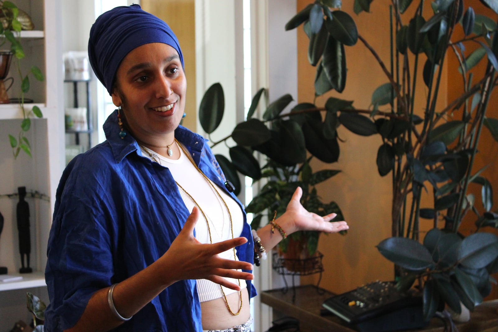 Darsheel Kaur walks through the Luv Locs Experiment Headquarters on Salem Avenue in Dayton on Thursday, July 24. STAFF/SYDNEY DAWES