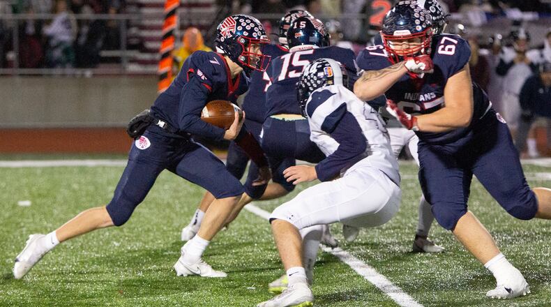 Piqua quarterback Brady Ouhl looks for running room against Edgewood during the first half of Friday night's Division II regional semifinal at Wayne. Jeff Gilbert/CONTRIBUTED