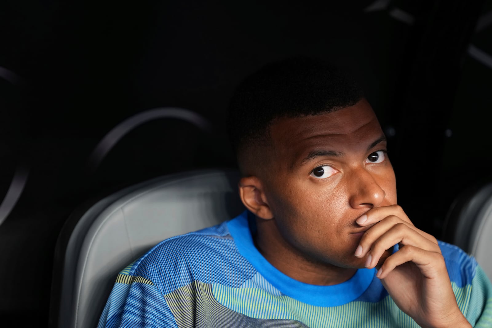 Real Madrid's Kylian Mbappe sits on the bench before the Club World Cup round of 16 soccer match between Real Madrid and Juventus in Miami Gardens, Fla., Tuesday, July 1, 2025. (AP Photo/Rebecca Blackwell)