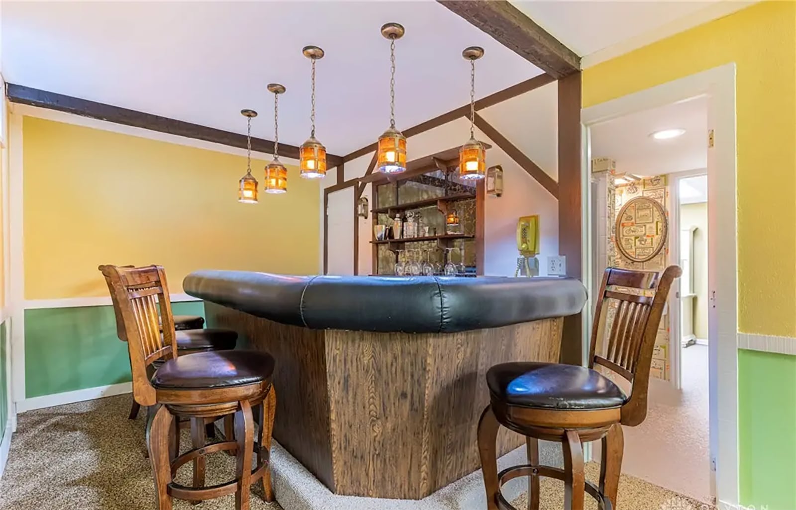 The basement has been finished and is inspired by an English pub. It has several finished areas and a full bathroom. CONTRIBUTED