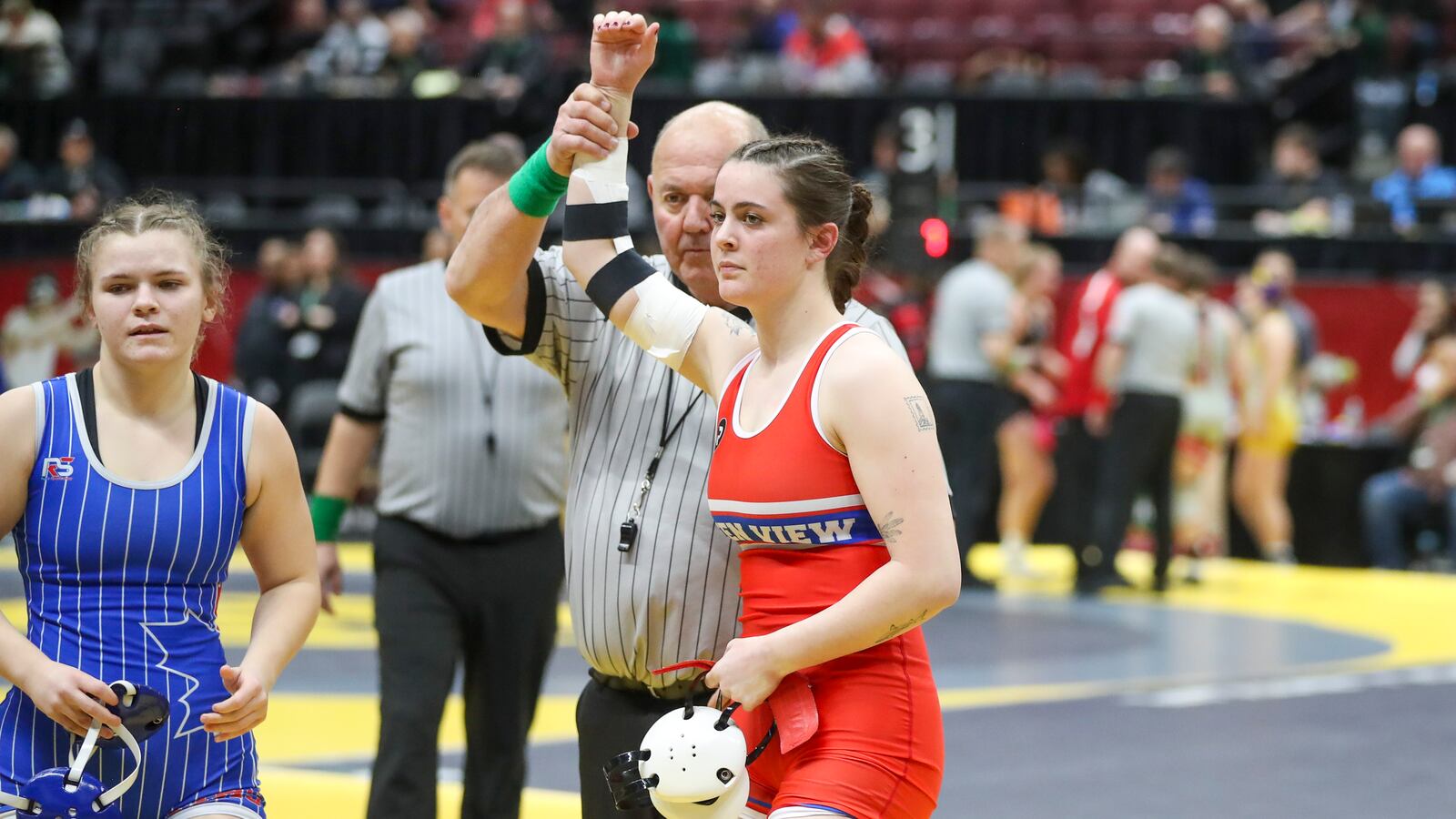 Greeneview High School's Eve Matt has her arm raised into the air after winning a match at the Ohio High School Athletic Association's state wrestling championships on Friday, March 7 at the Schottenstein Center in Columbus. Dave Thompson/CONTRIBUTED