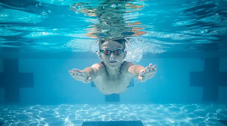 Tyler Gibble swimming at Pleasant Hill Swim Club, where he participates in summer programs. CONTRIBUTED