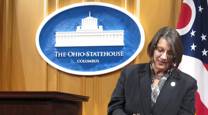 FILE - In this Sept. 17, 2015, file photo, Ohio state Rep. Nickie Antonio, a Democrat from Lakewood in suburban Cleveland, demonstrates tamper-resistant pain pills during a news conference in Columbus, Ohio. Ohio death penalty opponents are announcing a new effort to end capital punishment that includes several GOP supporters of a ban. Antonio, a longtime death penalty opponent, was joined at a news conference Thursday, Feb. 18, 2021, by three Republican senators who support ending capital punishment. (AP Photo/Andrew Welsh-Huggins, File)