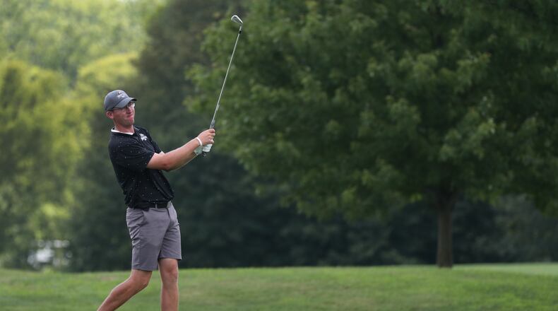 Austin Schoonmaker watches an approach shot during the final round of the Miami Valley Golf Association Metropolitan Amateur Championship at Piqua Country Club on Sunday, July 26, 2020. Schoonmaker won for the second straight year.