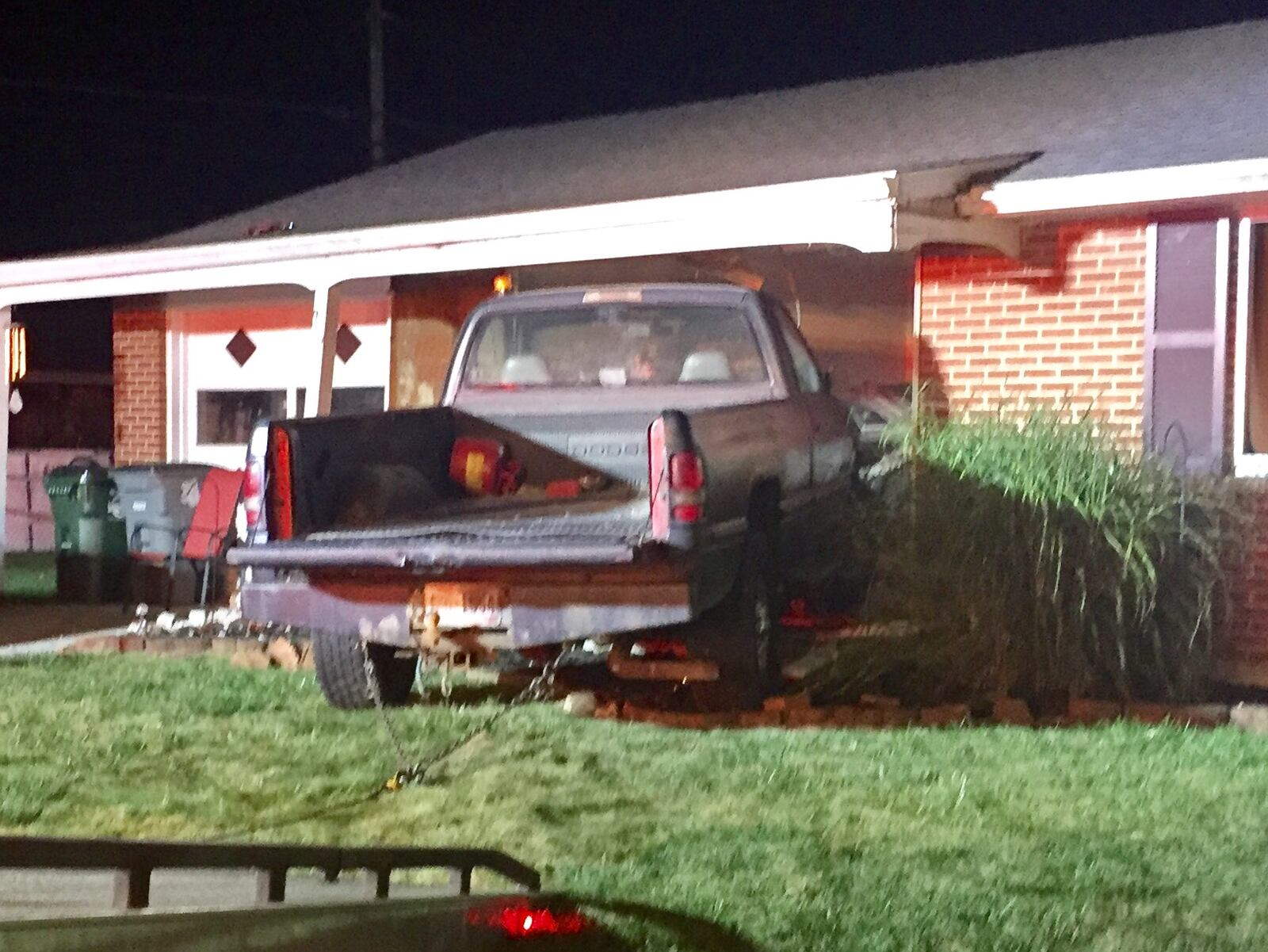 A truck can be seen crashed into the living room on a home in the 900 block of Linwood Avenue in Troy Sunday morning. Steve Baker/Staff