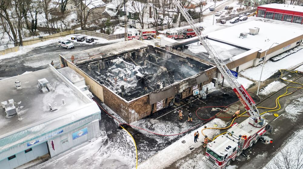 Heavy flames destroyed the roof of Prestige Home Furnishings at 2874 S. Dixie Drive on Monday, Dec. 15, 2025. NICK GRAHAM / STAFF