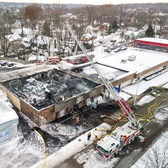 Heavy flames destroyed the roof of Prestige Home Furnishings at 2874 S. Dixie Drive on Monday, Dec. 15, 2025. NICK GRAHAM / STAFF