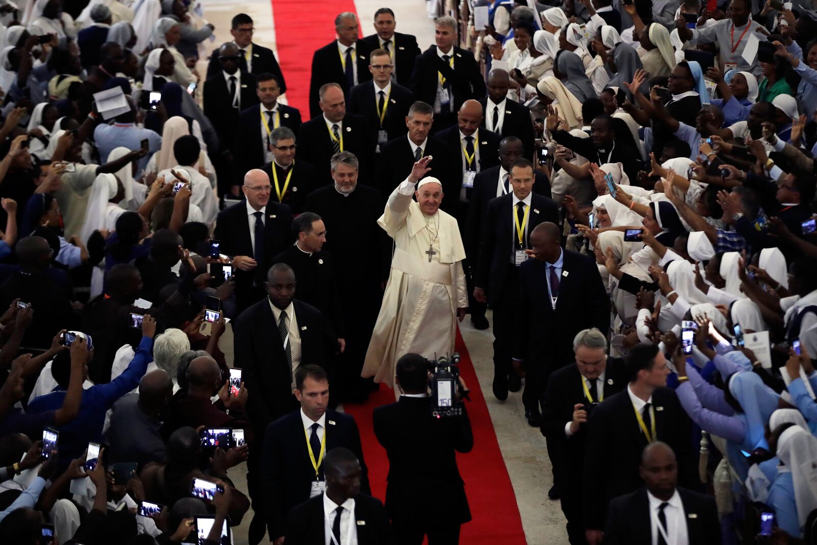 FILE - Pope Francis waves to the crowd at the Cathedral of the Immaculate Conception after attending a meeting in Maputo, Mozambique, Sept. 5, 2019. (AP Photo/Alessandra Tarantino, File)