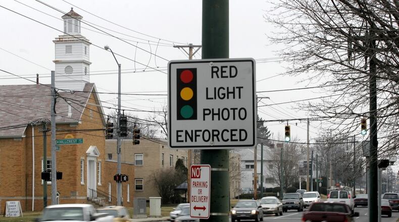 A sign warning of red light cameras near the Hillcrest Avenue intersection. STAFF