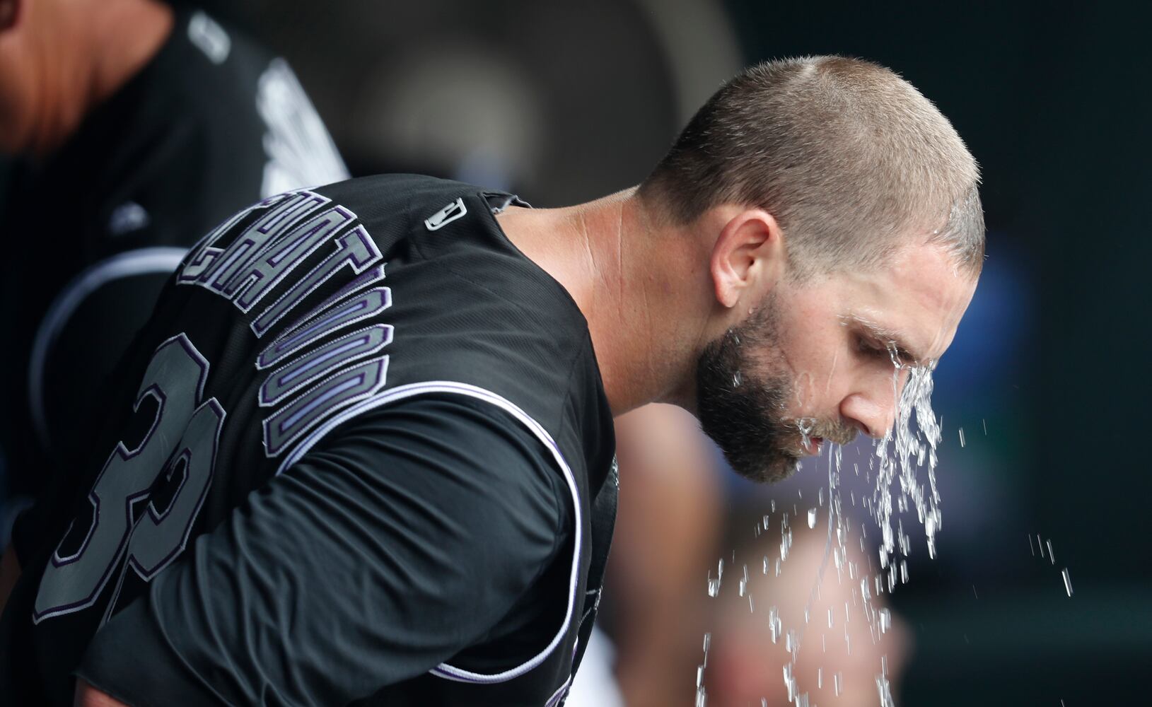 PHOTOS: Reds pile up 13 hits, beat the Rockies
