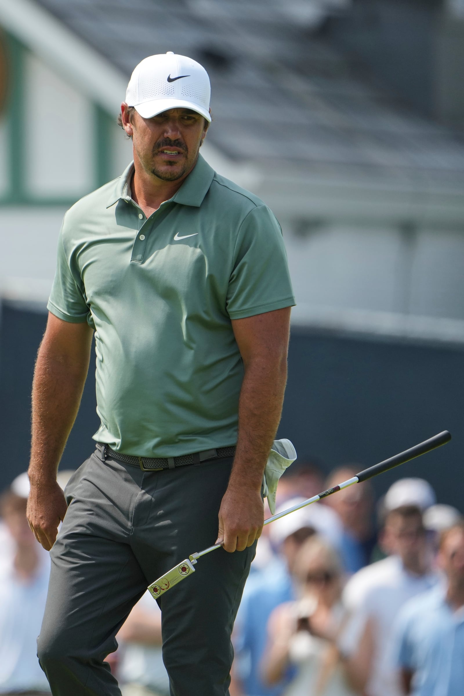 Brooks Koepka reacts to missing a putt on the ninth hole during the first round of the U.S. Open golf tournament at Oakmont Country Club Thursday, June 12, 2025, in Oakmont, Pa. (AP Photo/Gene J. Puskar)