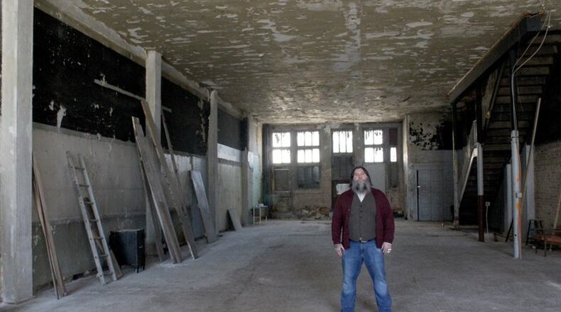 Joe Head, co-owner of Century Bar, inside the bar’s new home at 18-20 S. Jefferson St. AMELIA ROBINSON / STAFF
