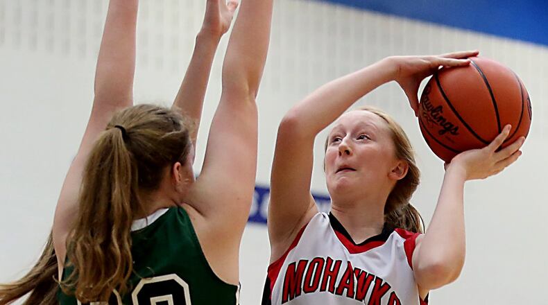Madison guard Ally King shoots over Bethel center Becky Schwieterman during their Division III sectional game at Franklin Monroe on Saturday. CONTRIBUTED PHOTO BY E.L. HUBBARD