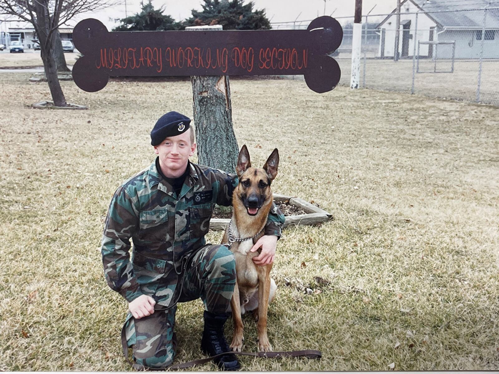 Airman Dan Watson poses with his military working dog, Arco, in front of Wright-Patterson Air Force Base’s kennels in the fall of 1994. Watson served his first assignment here as a military working dog handler before returning 25 years later as deputy chief and chief of acquisition law at the Air Force Materiel Command Law Office. CONTRIBUTED PHOTO