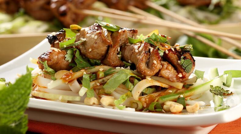 Use the crispy grilled pork on a rice noodle salad with romaine, cucumber, mint, basil and roasted peanuts. Styled by Mark Graham. (Michael Tercha/Chicago Tribune/TNS)