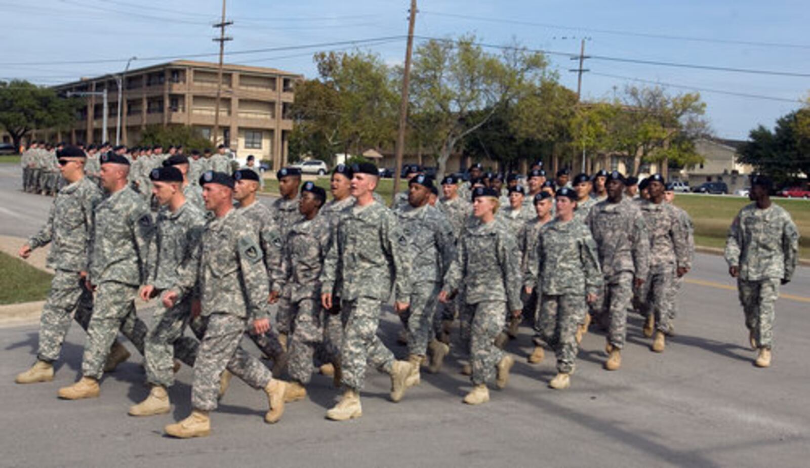 Soldiers at Fort Hood march to a memorial service for four soldiers who were killed in the massacre.