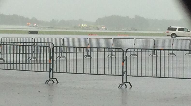 Weather and an accident involving a military plane practicing for the Dayton Air Show have affected travel at Dayton International Airport.