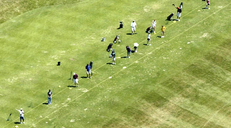 Golfers hit range balls at the WGC Golf Course in Xenia. FILE PHOTO