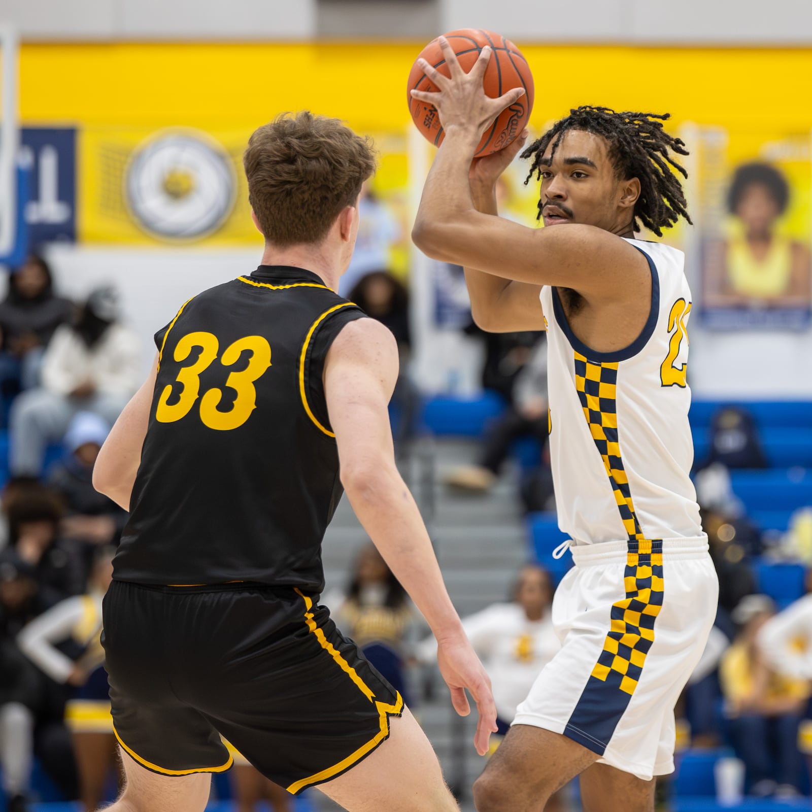 Springfield's EJ Rice is guarded by Centerville's Spencer Maxwell during their Greater Western Ohio Conference game on Tuesday, Feb. 3, 2026. The Elks won 56-44. MICHAEL COOPER / STAFF