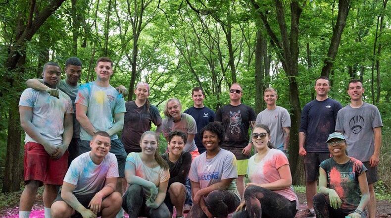 Volunteers pose for a group photo at the conclusion of the Lesbian, Gay, Bisexual and Transgender Pride Awareness Month 5K color fun run and walk at Wright-Patterson Air Force Base June 22. The LGBT event emphasized diversity and inclusion to help build a stronger workforce. (U.S. Air Force photo/Michelle Gigante)
