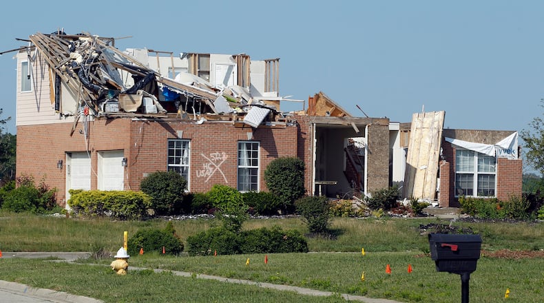 A tornado-damaged home in Trotwood’s Moss Creek development. Many homes in this former golf course were destroyed by the Memorial Day tornadoes. This photo was taken in late July. TY GREENLEES / STAFF