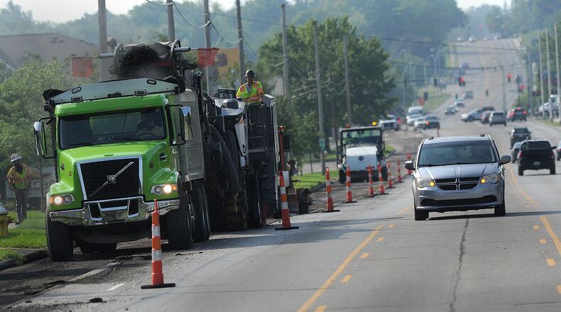 Resurfacing work on Wilmington Pike in Kettering started Wednesday morning,  July 26, 2023 near Stroop Road. MARSHALL GORBY\STAFF